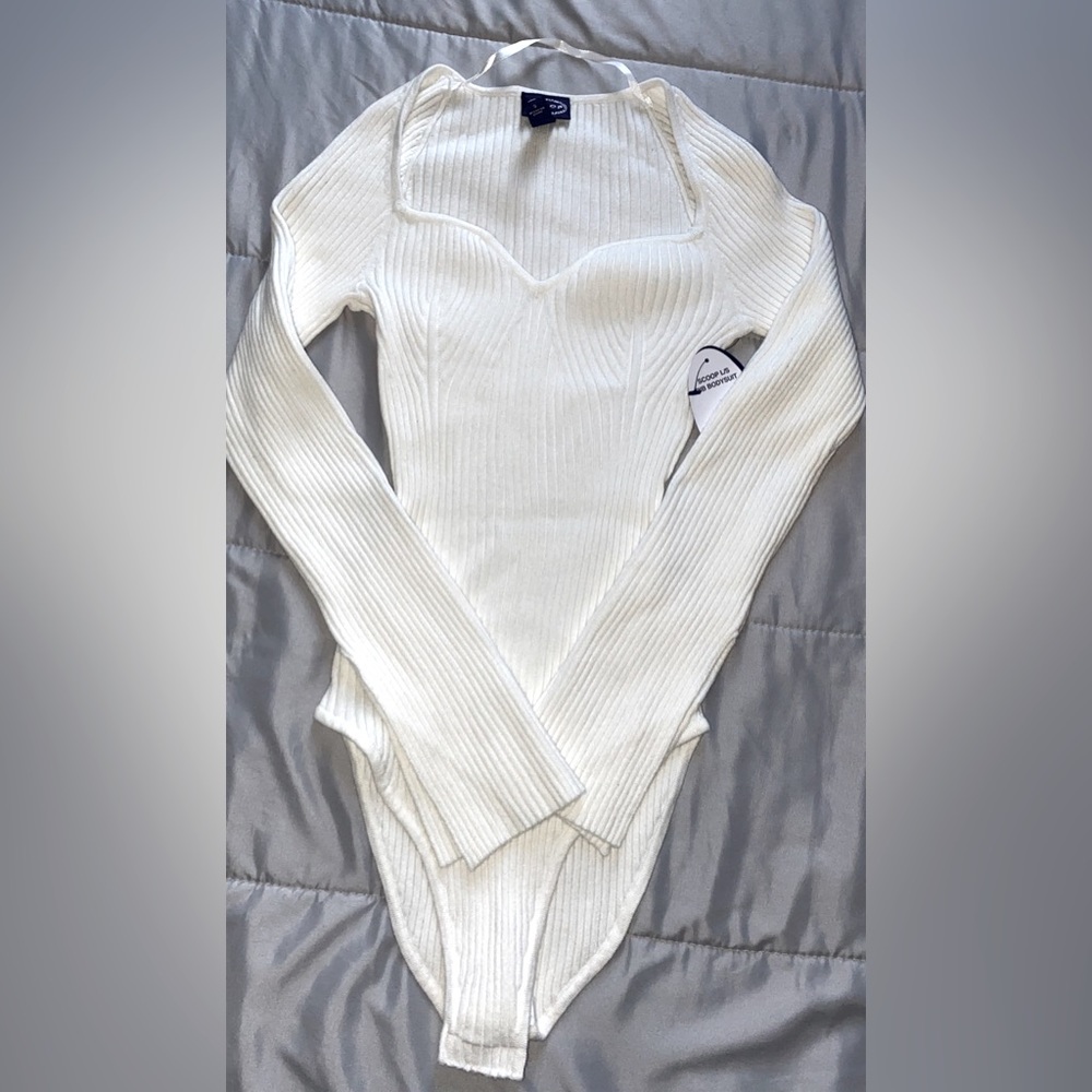 NWT Ribbed Bodysuit. Never worn! Could fit Small and Medium.Great quality